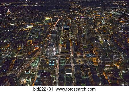 Stock Image - "Aerial view of Los Angeles cityscape lit up at night, California, United States". Fotosearch