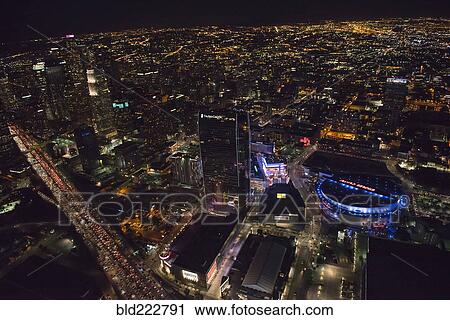 Stock Image - "Aerial view of Los Angeles cityscape lit up at night, California, United States". Fotosearch