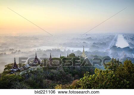 Stock Photograph - Aerial view of towers in misty landscape. Fotosearch