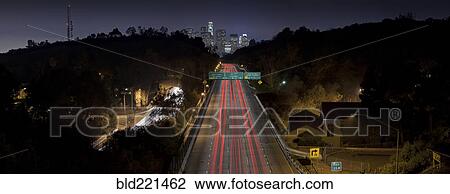 Stock Image - Aerial view of traffic on highway in Los Angeles cityscape, California, United States. Fotosearch