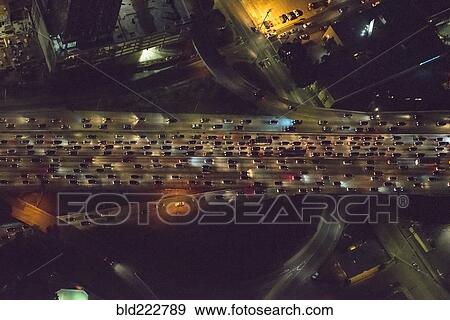 Aerial view of urban highway lit up at night View Large Photo Image Stock Photo - Aerial view of urban highway lit up at night. Fotosearch