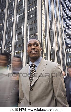 Stock Photography - African American businessman in urban scene. Fotosearch