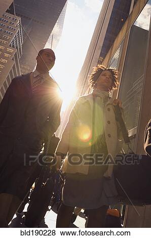 Stock Photo - African American couple on urban sidewalk. Fotosearch