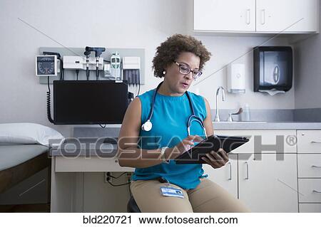 African American doctor using digital tablet View Large Photo Image Stock Image - African American doctor using digital tablet. Fotosearch