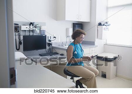 African American doctor using digital tablet View Large Photo Image Stock Photography - African American doctor using digital tablet. Fotosearch