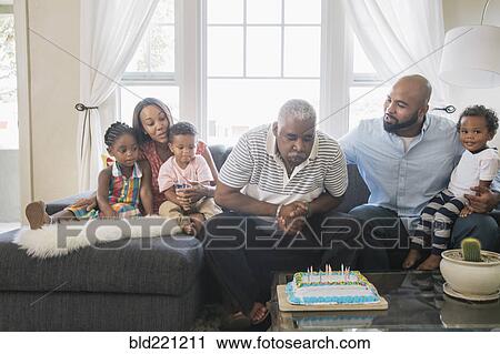 Stock Image - African American family celebrating birthday. Fotosearch
