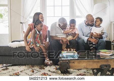 Stock Image - African American family celebrating birthday. Fotosearch
