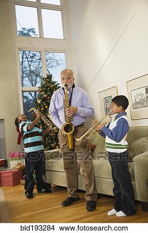 African American family playing musical instruments together View Large Photo Image Picture - African American family playing musical instruments together. Fotosearch