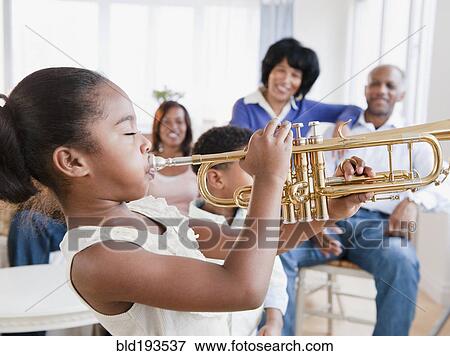 African American family watching daughter play trumpet View Large Photo Image Stock Photo - African American family watching daughter play trumpet. Fotosearch