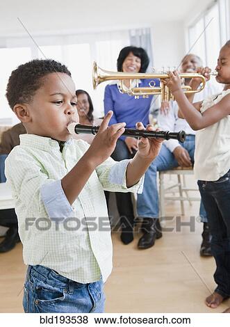 African American family watching children play instruments View Large Photo Image Stock Photo - African American family watching children play instruments. Fotosearch