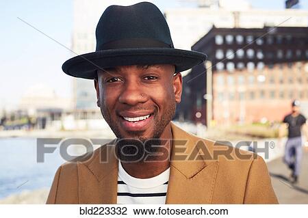 African American man smiling at waterfront View Large Photo Image Stock Image - African American man smiling at waterfront. Fotosearch