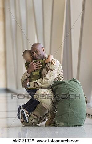 African American soldier hugging son in airport View Large Photo Image Stock Photography - African American soldier hugging son in airport. Fotosearch