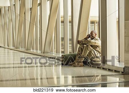African American soldier talking on cell phone in airport View Large Photo Image Stock Photo - African American soldier talking on cell phone in airport. Fotosearch