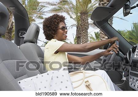African American woman driving convertible View Large Photo Image Stock Photo - African American woman driving convertible. Fotosearch