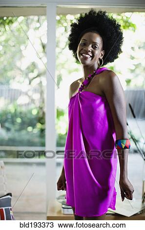 Stock Image - African American woman in glamorous dress. Fotosearch