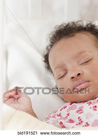 Stock Image - African baby sleeping. Fotosearch