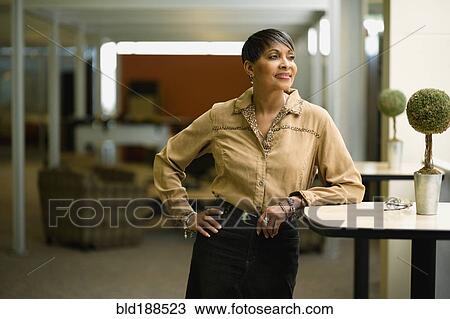 Stock Image - African businesswoman in modern office. Fotosearch