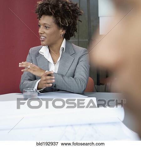 Stock Photo - African businesswoman talking. Fotosearch