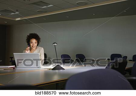 African businesswoman working on laptop in conference room View Large Photo Image Stock Image - African businesswoman working on laptop in conference room. Fotosearch