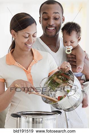 African couple and baby cooking View Large Photo Image Stock Photo - African couple and baby cooking. Fotosearch