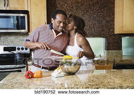 African couple fixing healthy meal in modern kitchen View Large Photo Image Stock Image - African couple fixing healthy meal in modern kitchen. Fotosearch