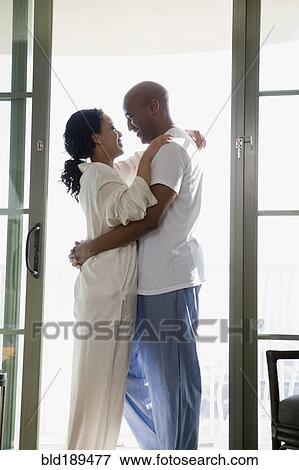 African couple in pajamas hugging View Large Photo Image Stock Photo - African couple in pajamas hugging. Fotosearch