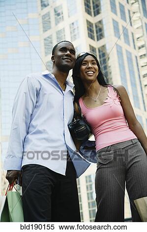 Stock Photography - African couple in urban scene. Fotosearch
