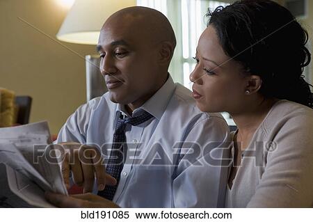 African couple reading newspaper View Large Photo Image Stock Photography - African couple reading newspaper. Fotosearch