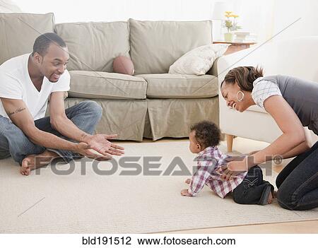 African couple with baby in living room View Large Photo Image Stock Image - African couple with baby in living room. Fotosearch
