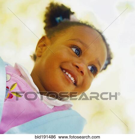 Stock Photograph - African girl smiling. Fotosearch