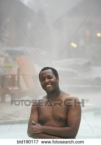 African man standing in hot tub View Large Photo Image Stock Photo - African man standing in hot tub. Fotosearch