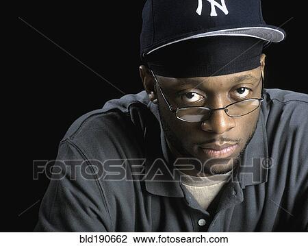 Stock Image - African man wearing eyeglasses. Fotosearch