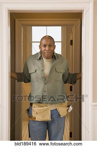 African man wearing tool belt View Large Photo Image Stock Photograph - African man wearing tool belt. Fotosearch