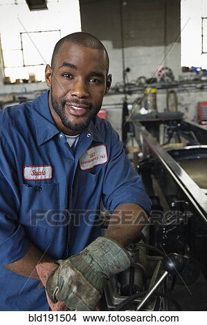 Picture - African mechanic in repair shop. Fotosearch