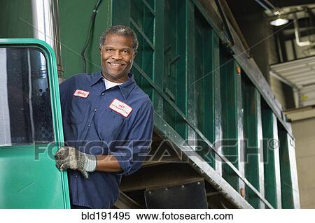 African mechanic standing on dump truck View Large Photo Image Stock Photography - African mechanic standing on dump truck. Fotosearch