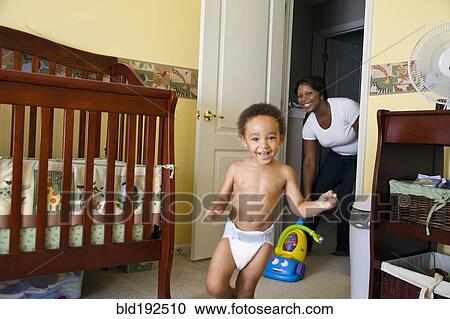 African mother chasing young son View Large Photo Image Stock Image - African mother chasing young son. Fotosearch
