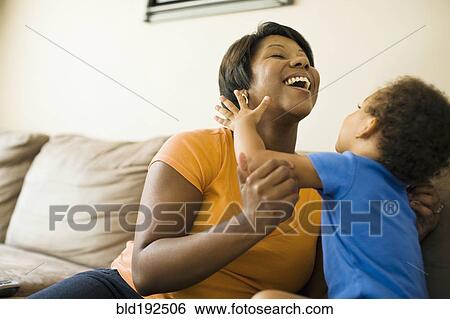 African mother playing with young son View Large Photo Image Stock Photograph - African mother playing with young son. Fotosearch