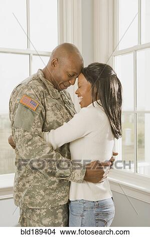 African soldier and girlfriend hugging View Large Photo Image Picture - African soldier and girlfriend hugging. Fotosearch