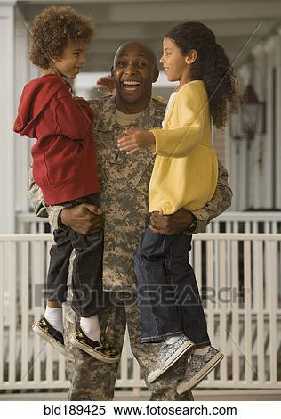 African soldier holding son and daughter View Large Photo Image Stock Photography - African soldier holding son and daughter. Fotosearch