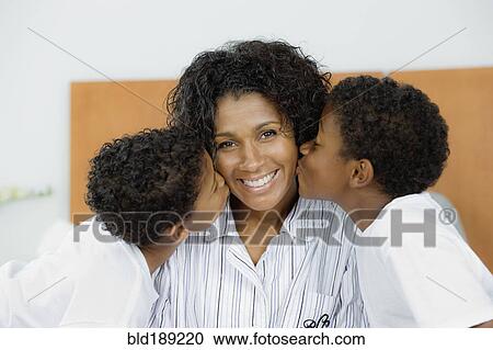 African sons kissing mother View Large Photo Image Stock Image - African sons kissing mother. Fotosearch