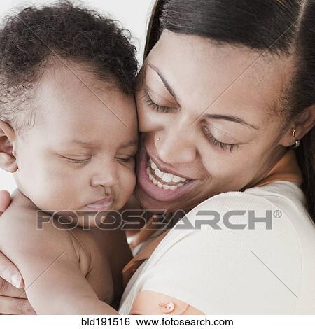 Stock Photograph - African woman hugging baby. Fotosearch