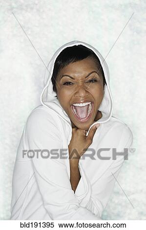 African woman in hooded shirt shouting View Large Photo Image Stock Photography - African woman in hooded shirt shouting. Fotosearch