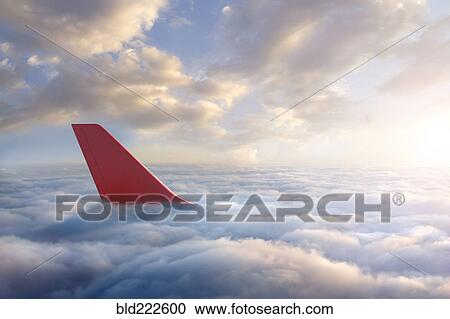 Airplane rudder above clouds View Large Photo Image Stock Image - Airplane rudder above clouds. Fotosearch