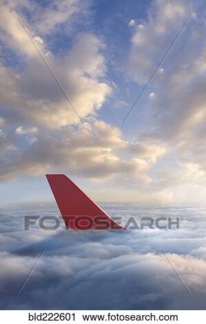 Airplane rudder above clouds View Large Photo Image Stock Image - Airplane rudder above clouds. Fotosearch