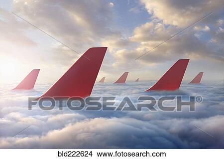Airplane rudders above clouds View Large Photo Image Picture - Airplane rudders above clouds. Fotosearch