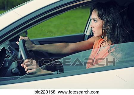 Angry Caucasian woman driving car View Large Photo Image Stock Photo - Angry Caucasian woman driving car. Fotosearch