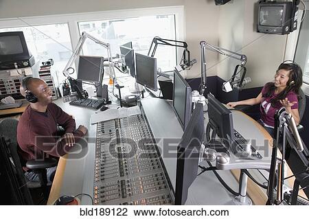 Asian dj working at radio station with co-worker View Large Photo Image Stock Image - Asian dj working at radio station with co-worker. Fotosearch