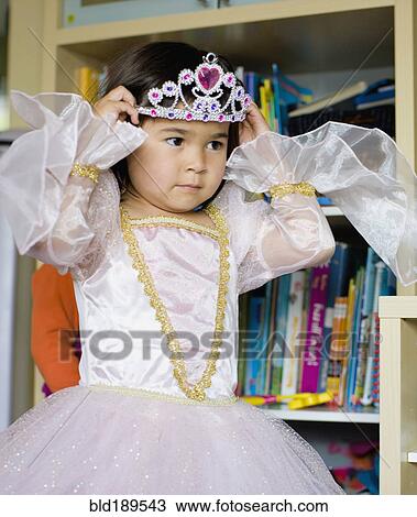 Stock Image - Asian girl dressing up in princess costume. Fotosearch