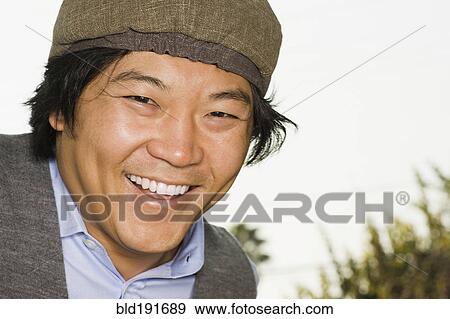 Stock Photo - Asian man smiling. Fotosearch