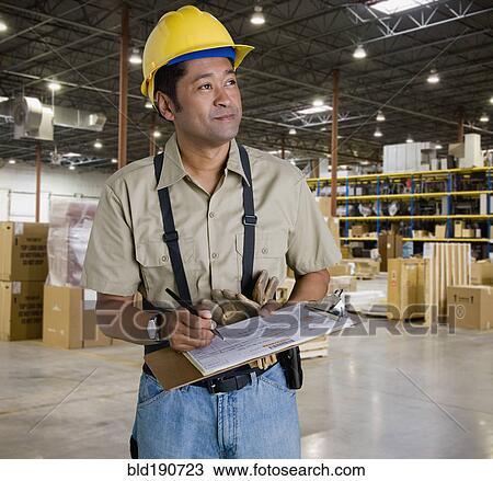 Asian man working in warehouse View Large Photo Image Stock Image - Asian man working in warehouse. Fotosearch